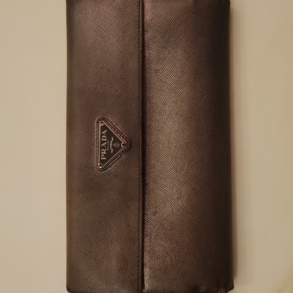 Prada Handbags - Prada Metallic Gray Wallet..Project Piece?